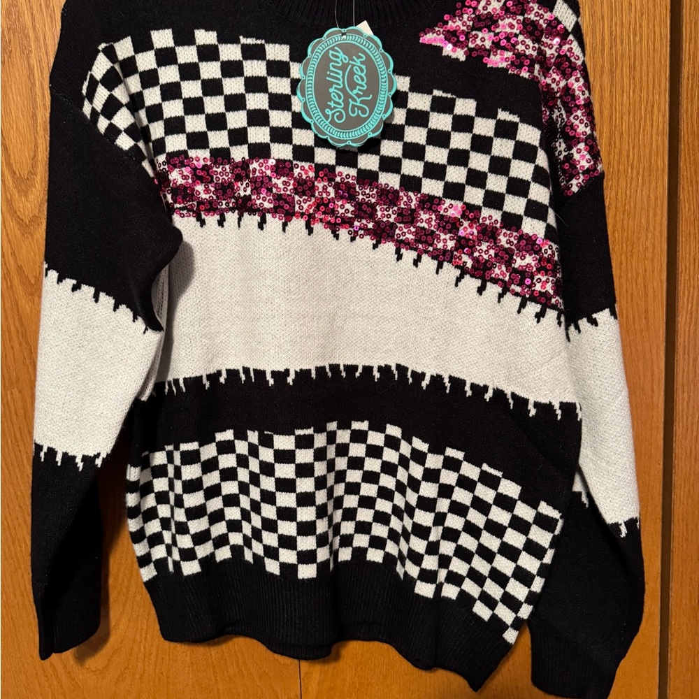 Trendy Black and White Checkered Sweater with Pink Accents